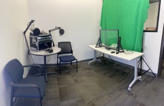 Lobby to training center with podcasting setup and green screen