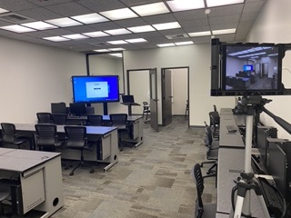 Main Training Center with computers and giant monitor